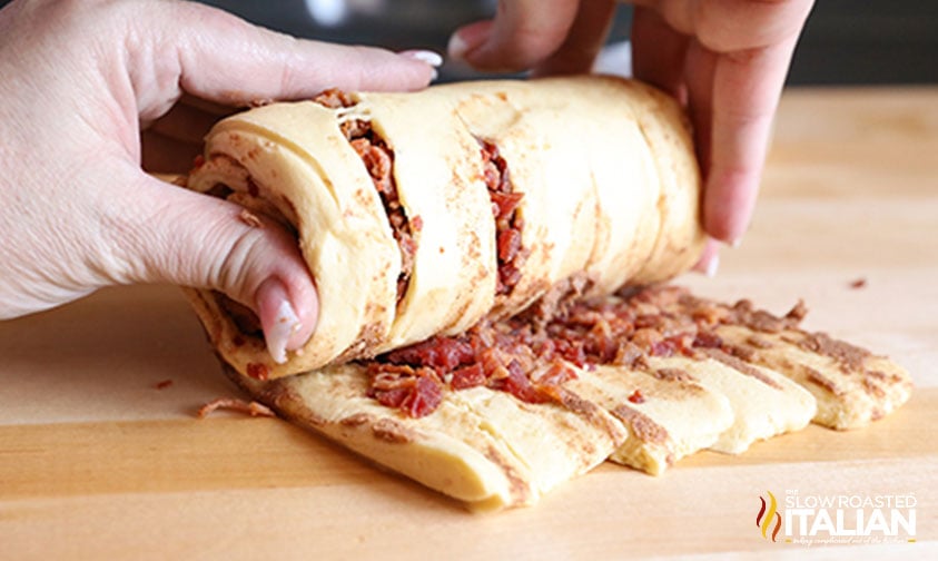 rolling up bacon cinnamon rolls