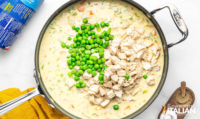 adding chicken and peas to pot pie mixture