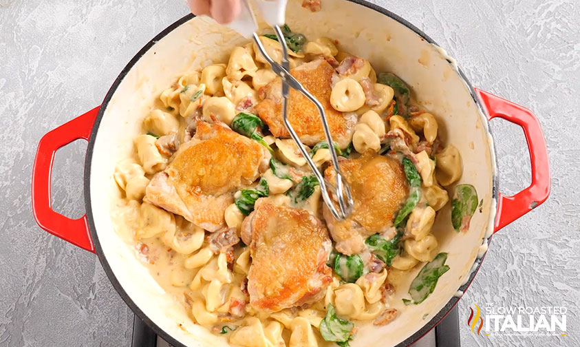 adding cooked chicken thighs to tortellini