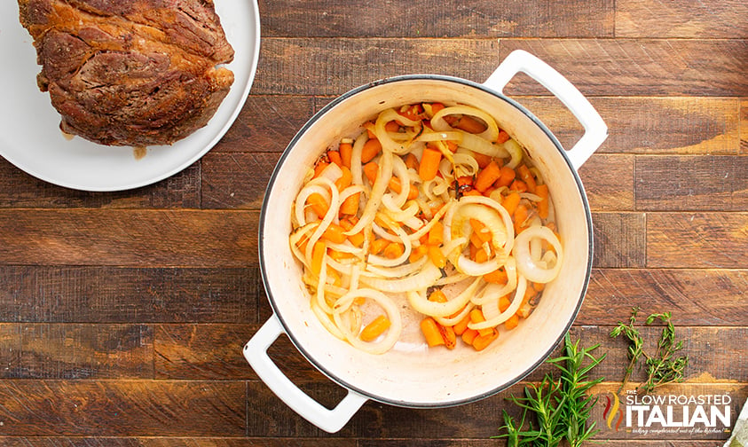 cooked onion and carrots in a pot