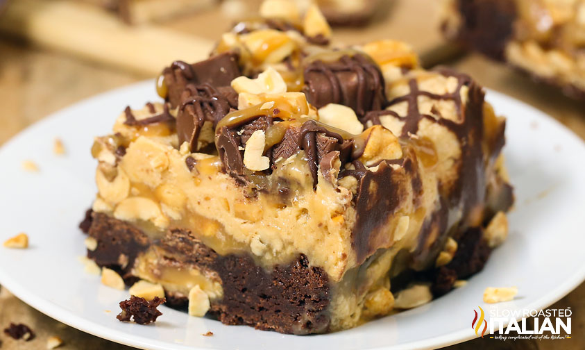 cut piece of Outrageously Peanutty Snickers Brownies