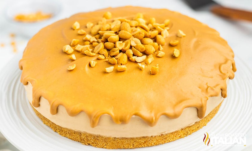 unsliced peanut butter cheesecake on a plate