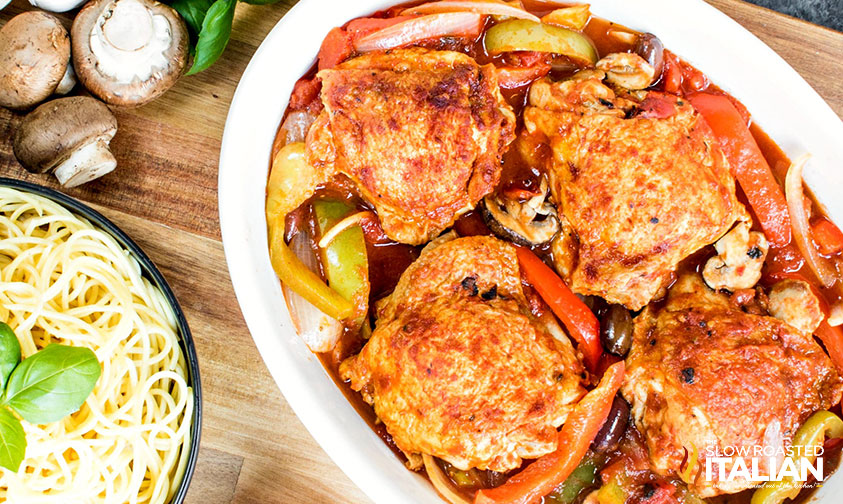 slow cooker chicken cacciatore next to a bowl of noodles