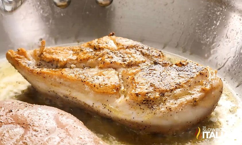 cooked chicken breast in a skillet