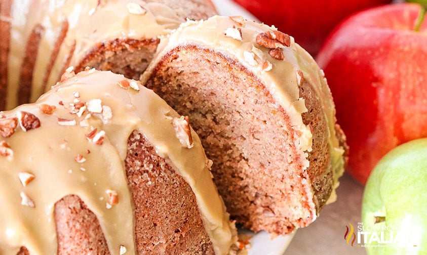 removing slice from glazed apple bundt cake