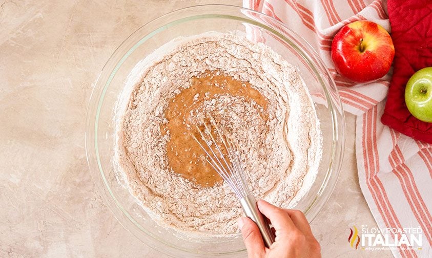 whisking spiced flour into cake batter