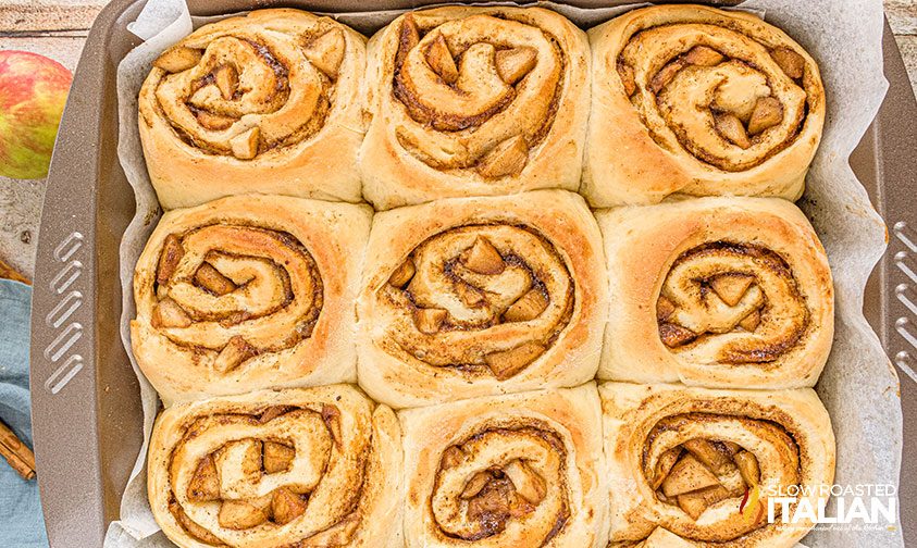 square pan with 9 baked cinnamon rolls