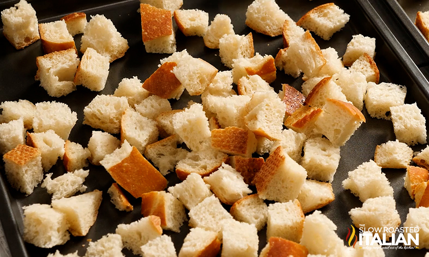 sourdough bread cubes on baking sheet