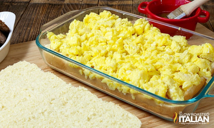 assembling breakfast sliders in casserole dish