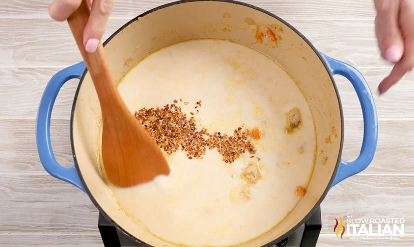 stirring half & half and spices into pot