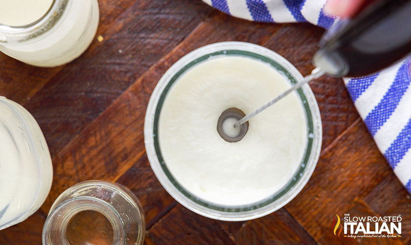 overhead: whipping sweet cream with milk frother