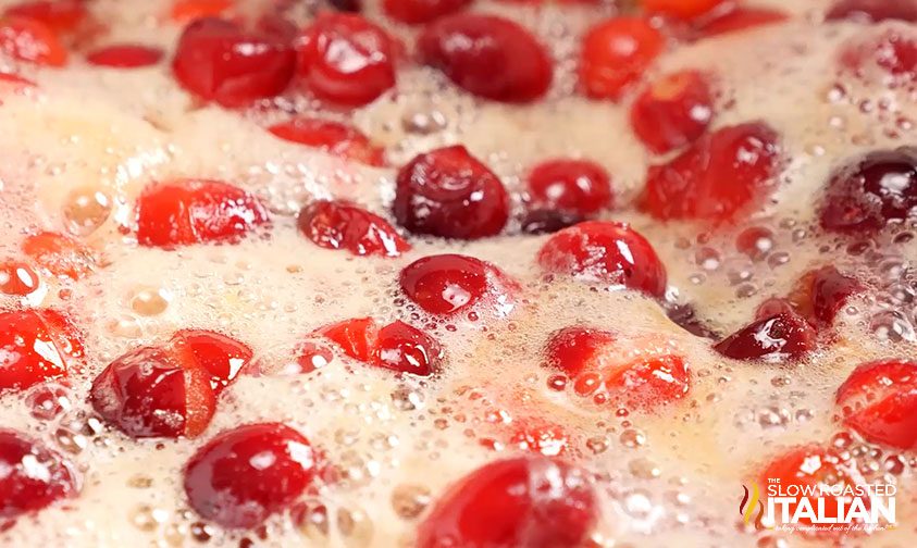 closeup: cranberries simmering in liquid