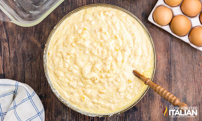 ingredients for corn casserole mixed together in a bowl