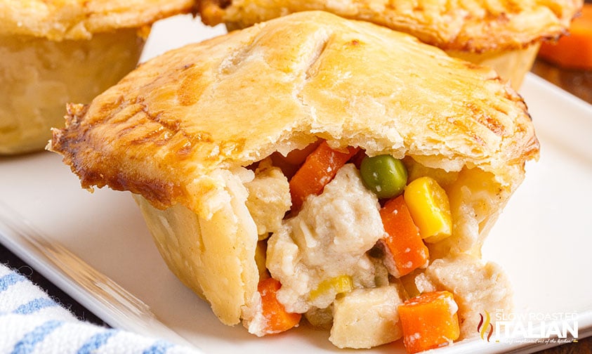 pot pie on platter with filling spilling out