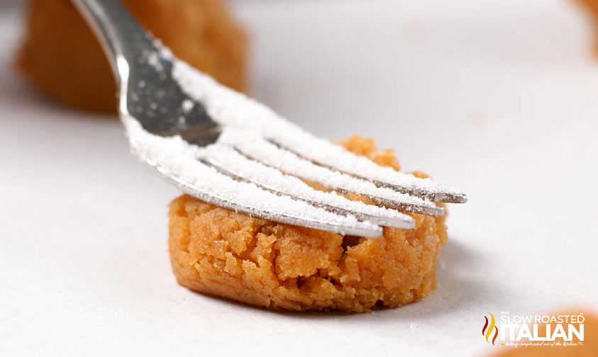 pressing cookie dough with a fork