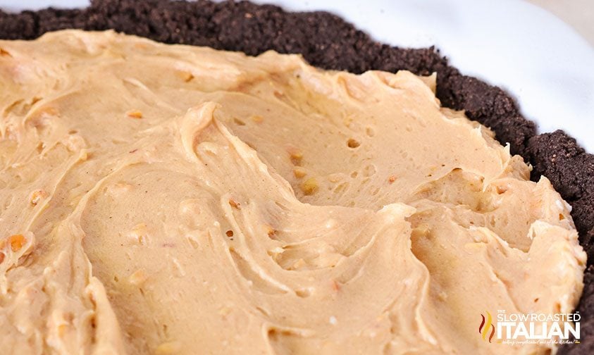peanut butter filling in chocolate cookie pie crust