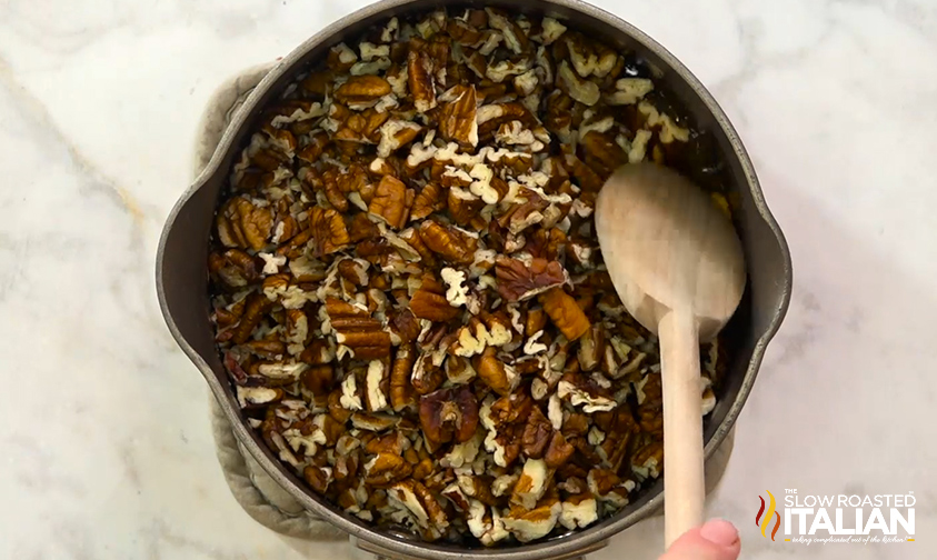 stirring pecans into sugar mixture