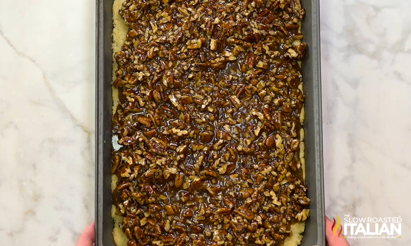 shortbread pecan pie bars in metal pan