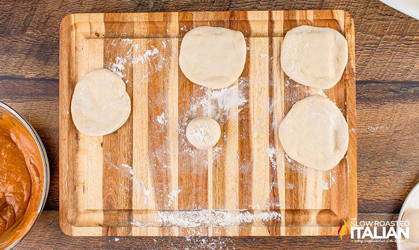 rolling out dinner roll dough