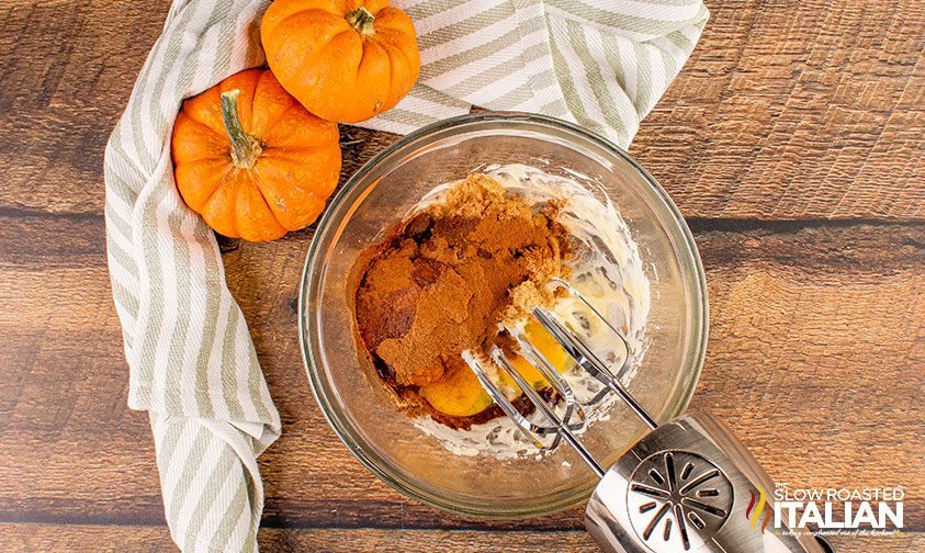 mixing pumpkin filling with hand mixer