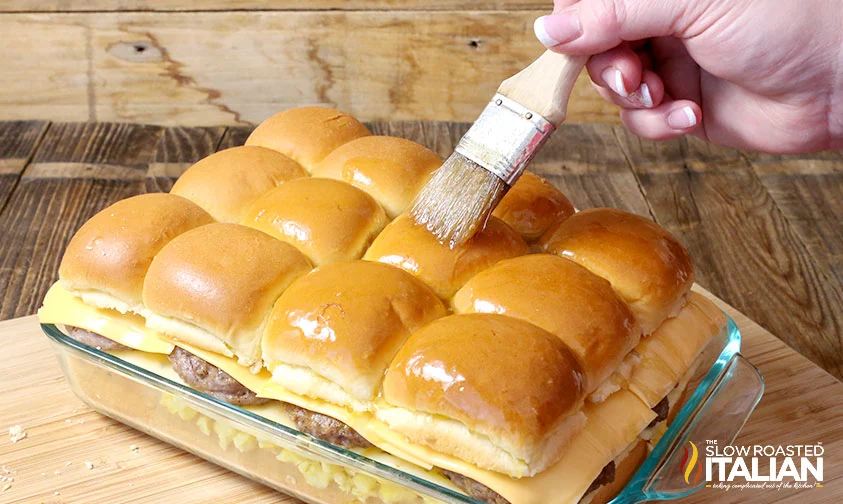 brushing maple butter over breakfast sliders