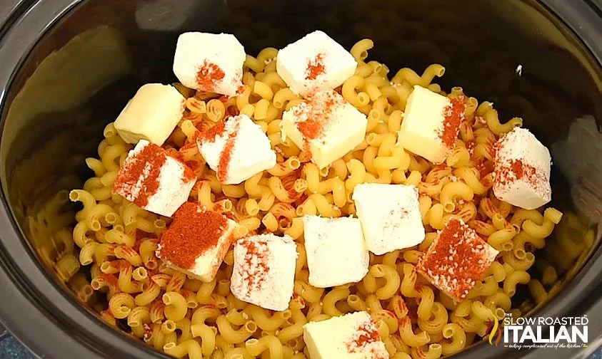 butter and paprika over noodles in crock pot