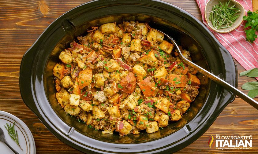 large spoon in crock pot with stuffing