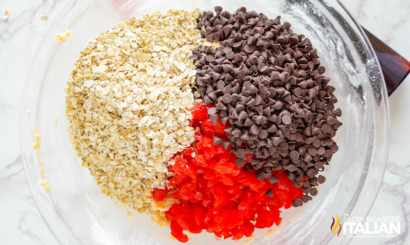 chocolate chips, diced cherries and oats in a mixing bowl