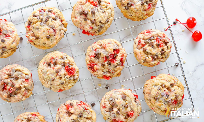 baked cherry chocolate chip cookies on a cooling rack