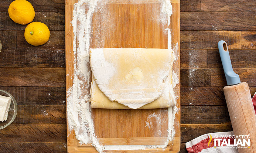 folding dough to create flaky layers