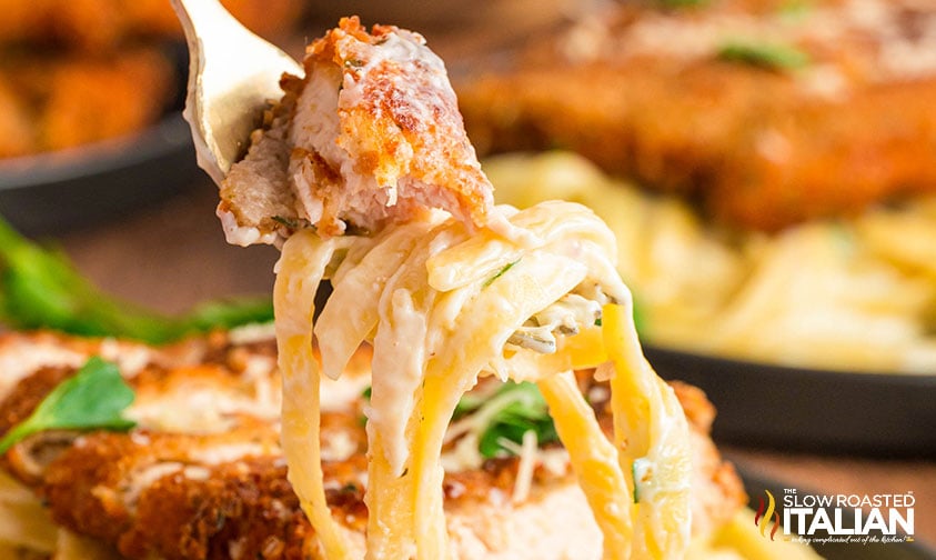 crispy chicken fritta on a fork with pasta