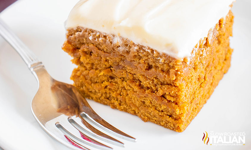 piece of gingerbread cake on a plate with a fork