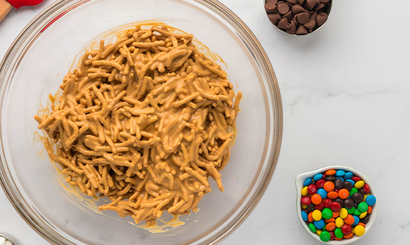 mixing noodles into melted chocolate