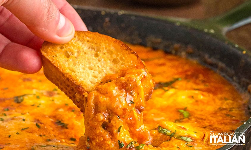 toasted bread dipped in lasagna dip