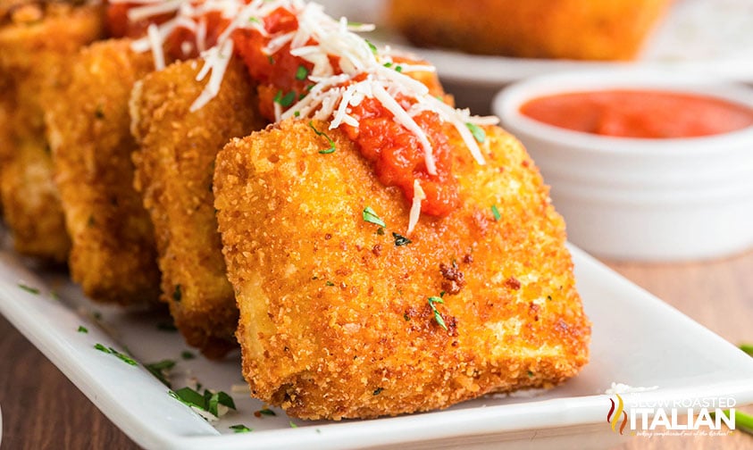 fried lasagna fritta on a serving tray