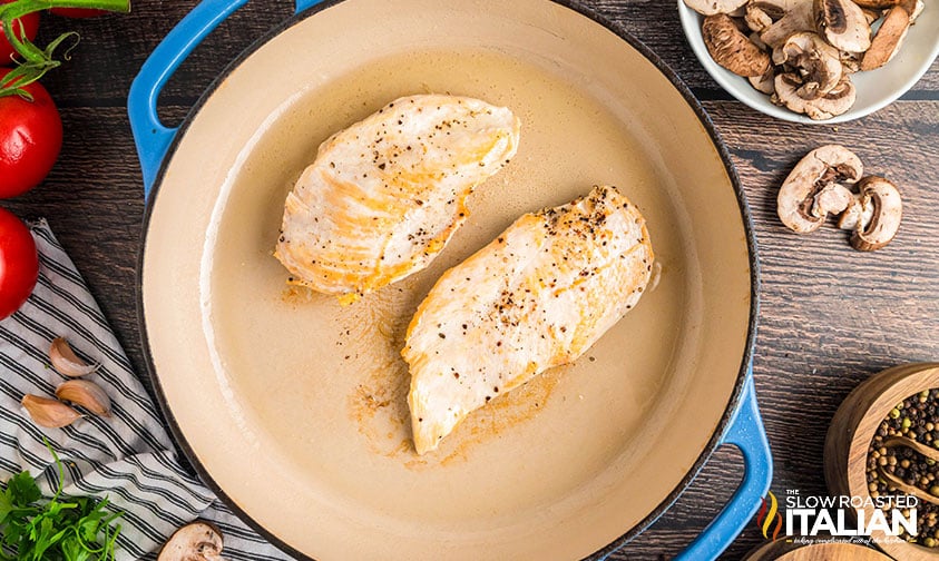 searing sliced chicken breast in a skillet