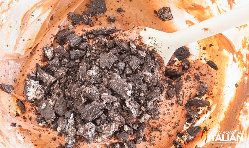 adding crushed oreos to cheesecake batter