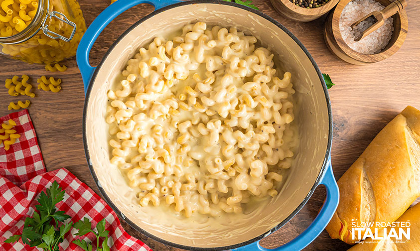 stirring in cooked pasta