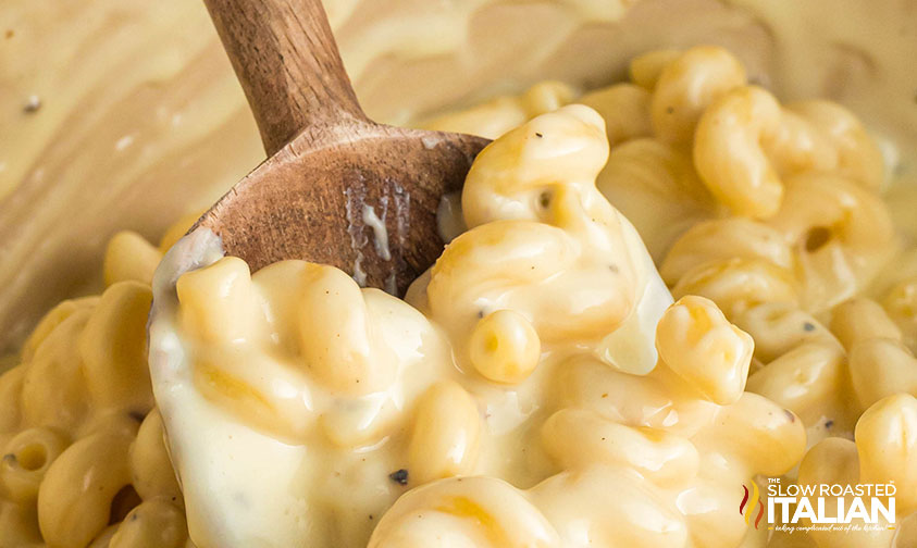 wooden spoon stirring panera copycat mac and cheese