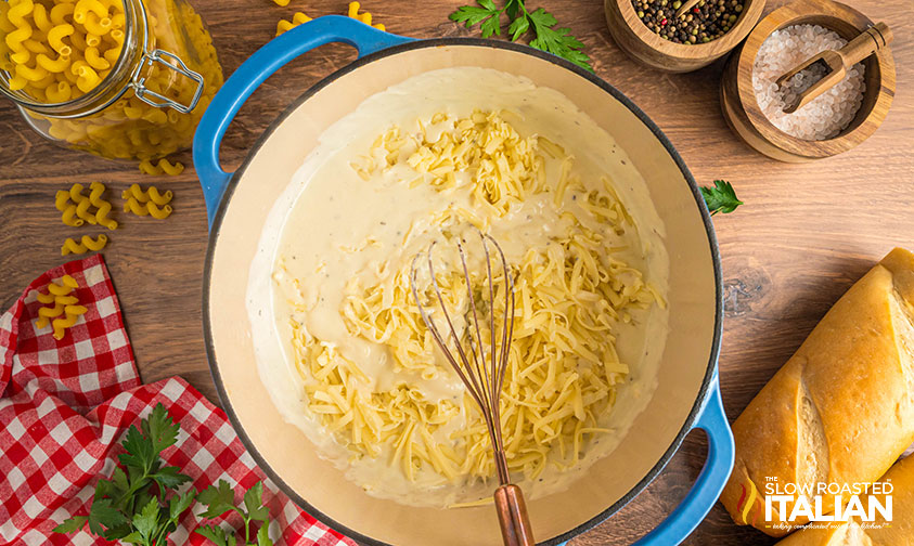 adding cheese to melt in heavy bottom pot