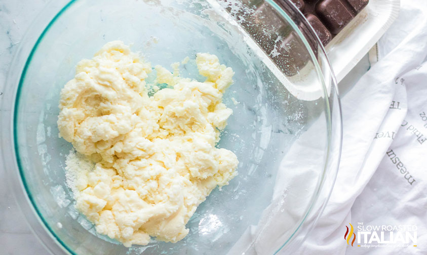 sweetened condensed milk, vanilla and powdered sugar mixed in a glass bowl