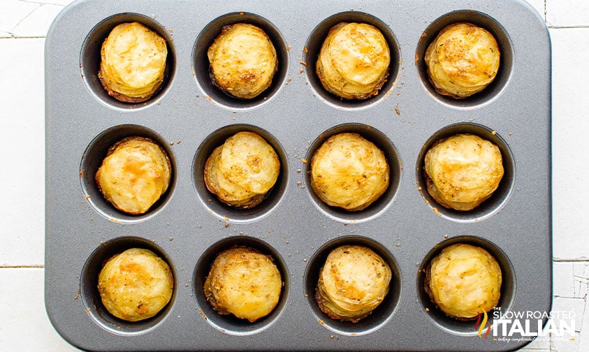 cooked potato stacks in muffin tin