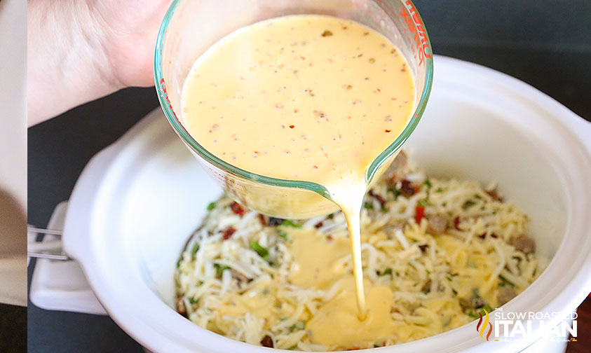 pouring eggs into crockpot