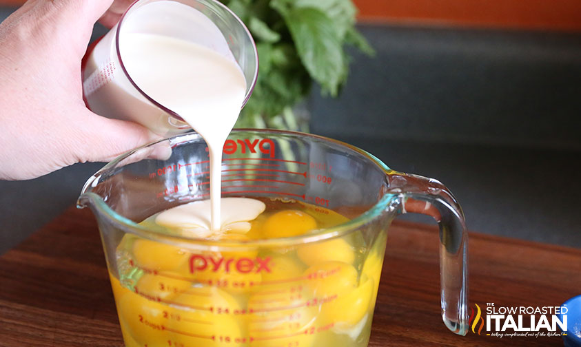 adding cream to eggs