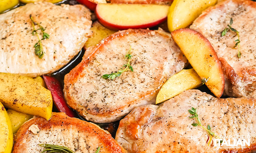 pan seared pork chops topped with apples and herbs