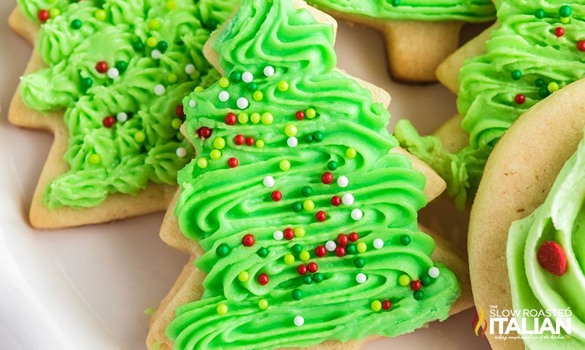tree cookies with piped green frosting and sprinkles