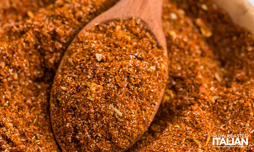 closeup: wooden spoonful of homemade fajita seasoning