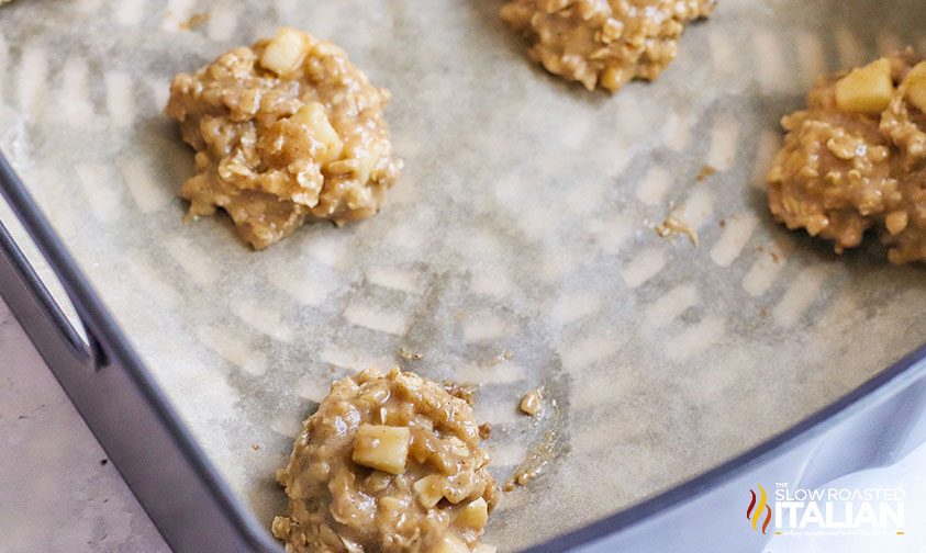 rounds of oatmeal cookie dough on parchment in air fryer