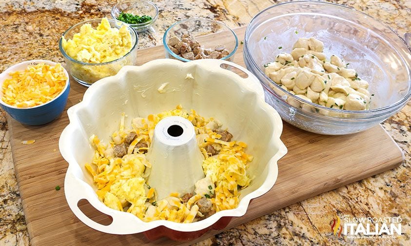 layering breakfast ingredients in bundt pan