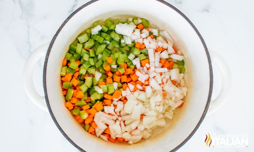 celery, carrots and onion in a pot.